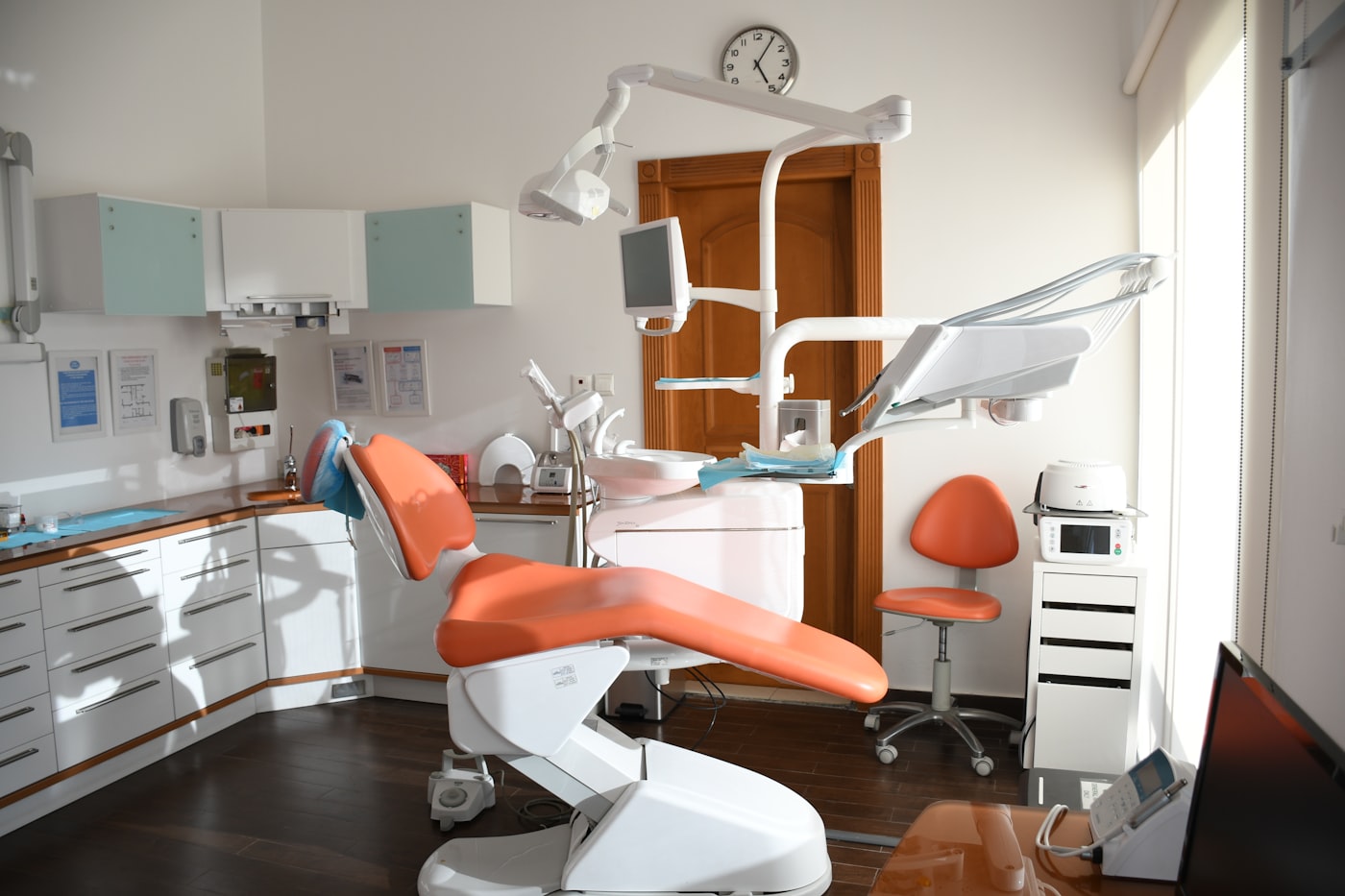 A dentist at work in a treatment room
